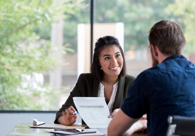 Cheerful businesswoman meets with client
